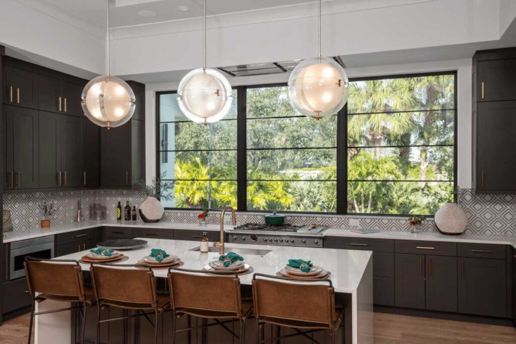 Hurricane Windows in Pinellas County, FL installed in a modern kitchen with dark cabinets and a large window.