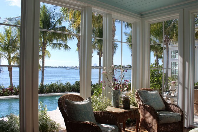 Bright coastal interior featuring large panoramic Irvine, CA Windows offering natural light and scenic waterfront views