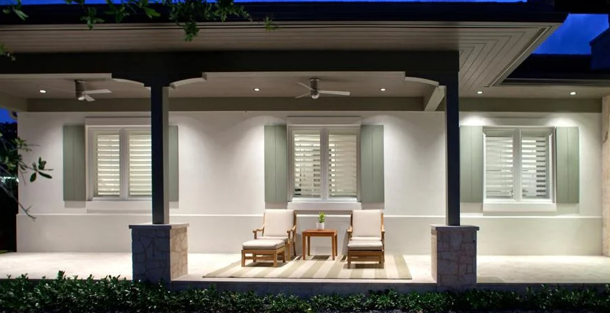 Stylish house exterior with outdoor seating and hurricane windows St. Petersburg, FL for durability
