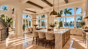 Luxury waterfront kitchen featuring expansive white-framed windows with palm trees and water views